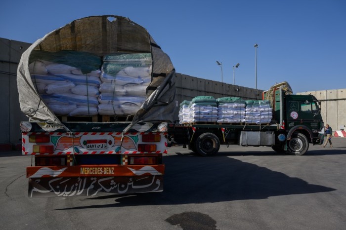 A truck carrying humanitarian aid waits to enter gaza after being checked after arriving from Egypt at the Kerem Shalom Crossing on December 22, 2023 in Kerem Shalom, Israel. For the first-time since the outbreak of the war, aid trucks are now flowing through the Kerem Shalom crossing point, that was approved by Israel to allow the delivery of humanitarian aid to Gaza. As of December 20th over 75 trucks, delivering mostly food, have entered into Gaza via Kerem Shalom, with over 165 trucks between both Kerem Shalom and Nitzana, according to the Coordination of Government Activities and Territories (COGAT).