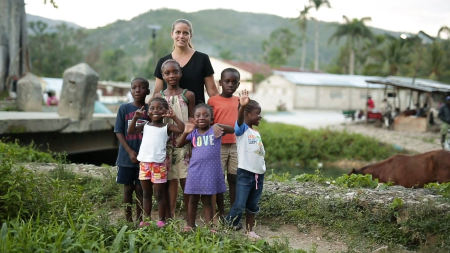 U.S. missionary Jill Dolan poses with some of the children from her orphanage in Haiti.