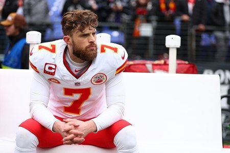 Kansas City Chiefs kicker Harrison Butker sits on the sideline of the AFC Championship in Baltimore, Maryland, on January 28, 2024.