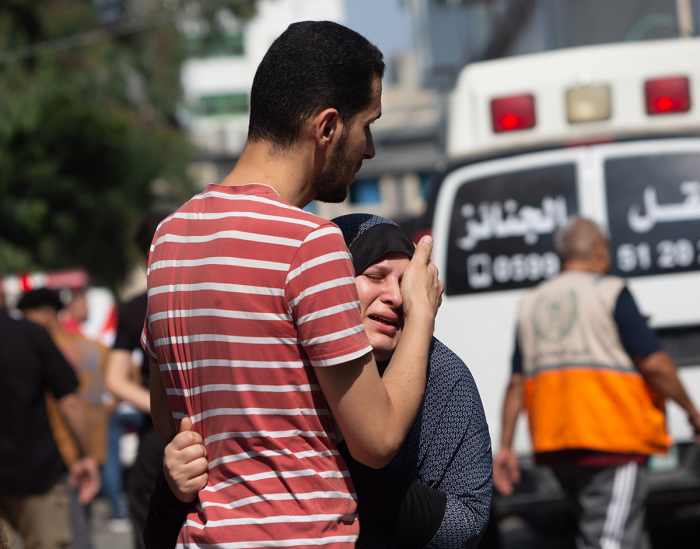 A woman cries during a funeral procession at Al-Shifa Hospital on October 11, 2023 in Gaza City, Gaza.. 