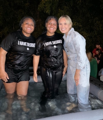 Students are baptized in pick-up trucks outside of the Stegeman Coliseum in Athens, Georgia, as part of a gathering by the student evangelism group Unite US on Wednesday, April 3, 2024. 