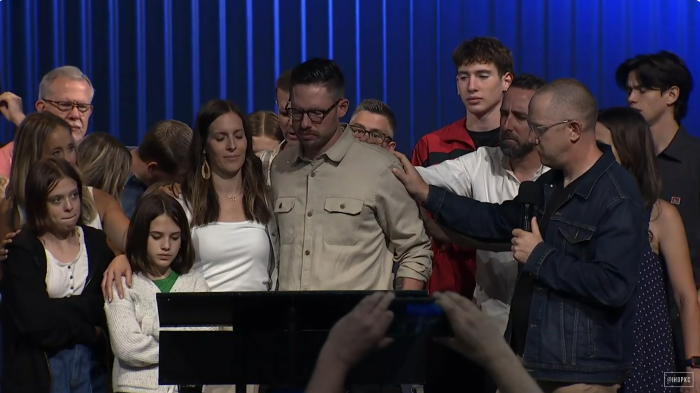 Forerunner Church Senior Pastor Isaac Bennett receives prayer from his congregation on Sunday May 19, 2024.