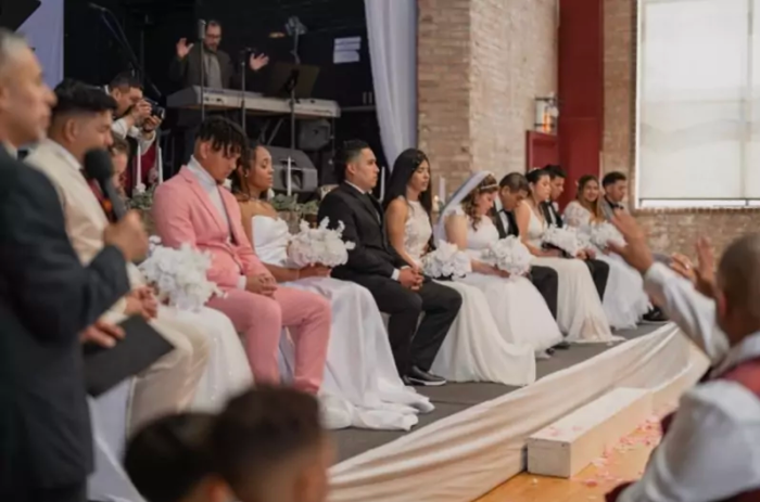 Seven immigrant couples participate in a collective wedding ceremony hosted by New Life Community Church's La Villita Church in Chicago, Illinois. 