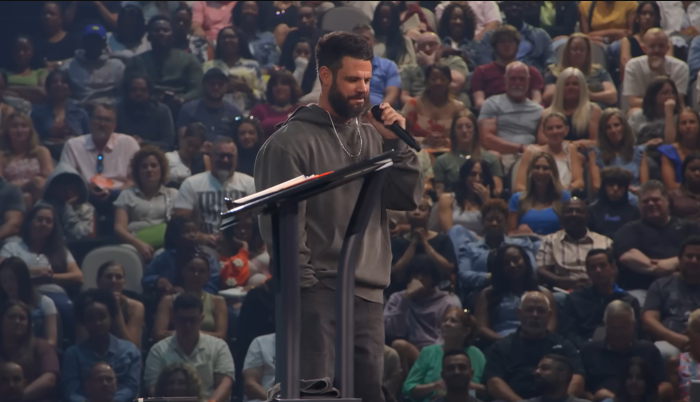 Elevation Church leader Steven Furtick delivers a sermon to congregants.