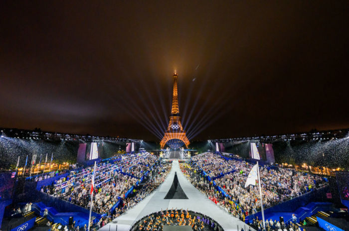 The Olympic flag is raised at the Place du Trocadero in front of the Eiffel Tower during the Opening Ceremony of the Olympic Games Paris 2024 on July 26, 2024 in Paris, France. 