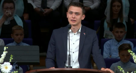 Michael Stavkovy, the older brother of the late Matthiew Stavkovy, 13, tears up as his reads his life story over his open casket at Way To Salvation church in Kent, Washington.