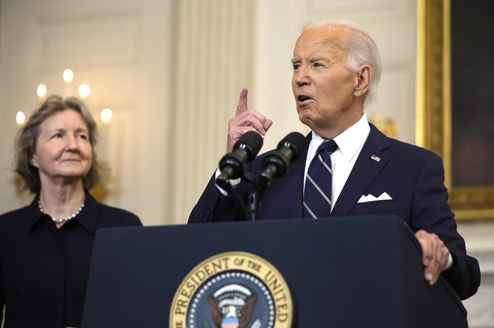 U.S. President Joe Biden delivers remarks on the release of Wall Street Journal reporter Evan Gershkovich and former U.S. Marine Paul Whelan from Russian captivity, in the State Dining Room at the White House on August 01, 2024, in Washington, D.C. The two, along with Alsu Kurmasheva, a dual U.S.-Russian citizen and Radio Free Europe journalist, were released in a prisoner exchange with Russia. Also pictured is Whelan's sister Elizabeth Whelan. 