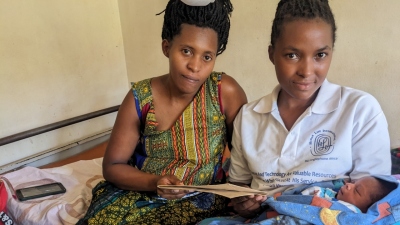 Laurence (L) with her daughter Keilla and an HLI Rwanda staff member.