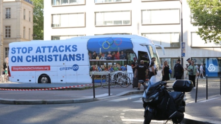 CitizenGO's bus, above, drove around Paris, France, for hours on Monday before French police stopped it at gunpoint and arrested its driver and six Christian campaigners.