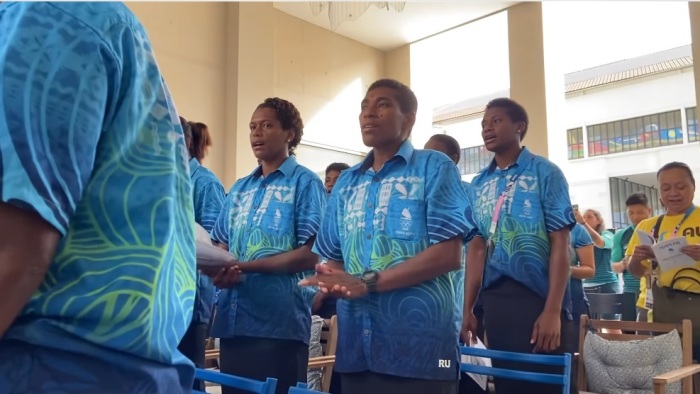 Team Fiji athletes, coaches and staff sing a worship hymn in Olympic Village in Paris, France, during the 2024 Summer Olympics. 