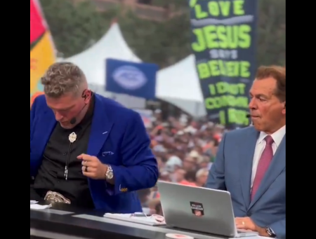 Pat McAfee (L) dances in his seat during a commercial break on ESPN's College GameDay his new co-host, Nick Saban, looks on on August 31, 2024.