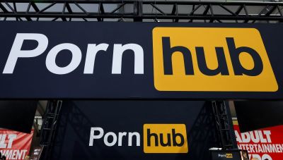 Signs are displayed at the Pornhub booth at the 2024 AVN Adult Entertainment Expo at Resorts World Las Vegas on January 25, 2024 in Las Vegas, Nevada. 