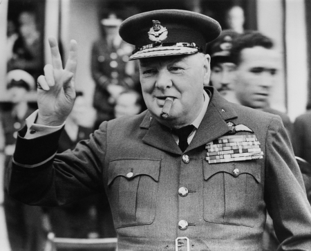 Winston Churchill (1874-1965) gives his famous V-sign as he opens the new headquarters of 615 (County of Surrey) Squadron of the RAAF (Royal Auxiliary Air Force) at Croydon, 1948. 