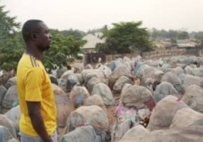 Pastor Barnabas is photographed standing inside a displacement camp in Nigeria. 