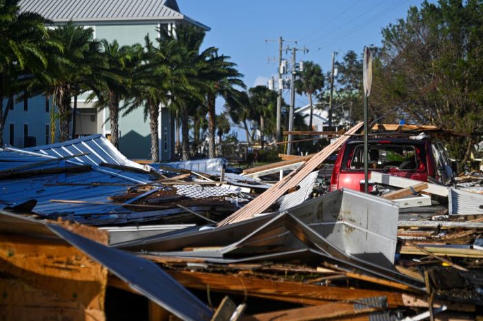 Debris left by Hurricane Helene after making landfall are seen in Cedar Key, Florida, on September 27, 2024. Hurricane Helene weakened on September 27 hours after it made landfall in the US state of Florida, with officials warning the storm remained 'extremely dangerous' as it surged inland, leaving flooded roads and homes in its wake. 