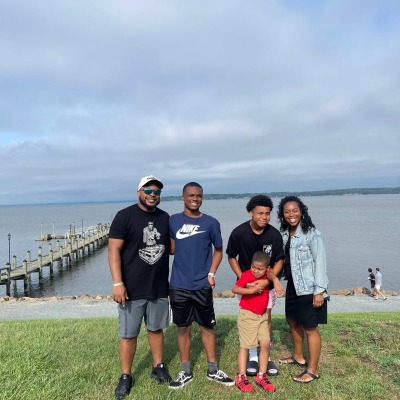 The Alston family from left to right: Saad Alston, Sr. (far left), AJ Alston, Isaiah Alston, Krystal Alston and Kristian Alston (C).