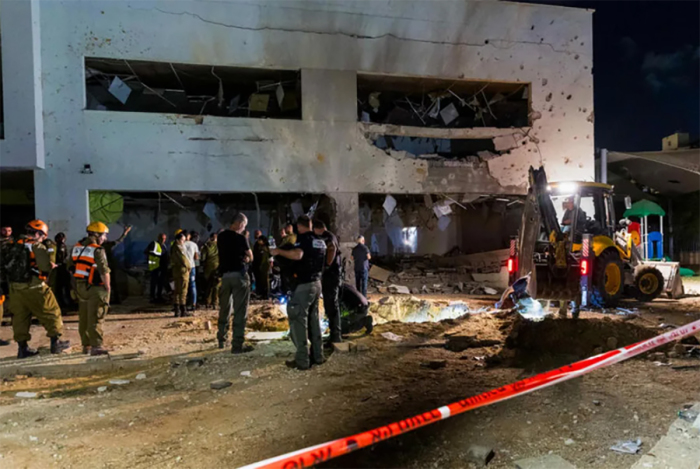 Israeli security forces at the scene where a missile fired from Iran hit a school in the town of Gedera, on Oct. 1, 2024.