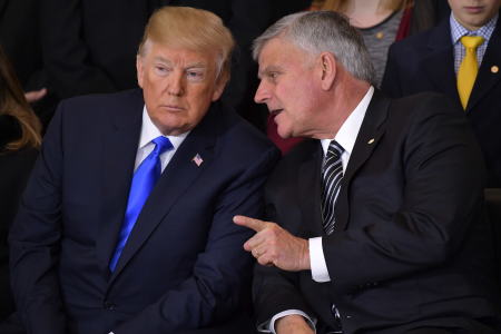 Former President Donald Trump listens to Billy Graham's eldest son Franklin Graham during the memorial service for the Rev. Billy Graham in the U.S. Capitol rotunda on Feb. 28, 2018, in Washington, D.C.