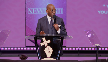 Pastor Jamal Bryant, leader of New Birth Missionary Baptist Church in Stonecrest, Ga., preaches to his congregation on Oct. 20, 2024. 