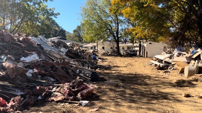 Debris remains piled in the ruined neighborhood that served as the backdrop for former President Donald Trump's press conference in Swannanoa, North Carolina, on Oct. 21, 2024.