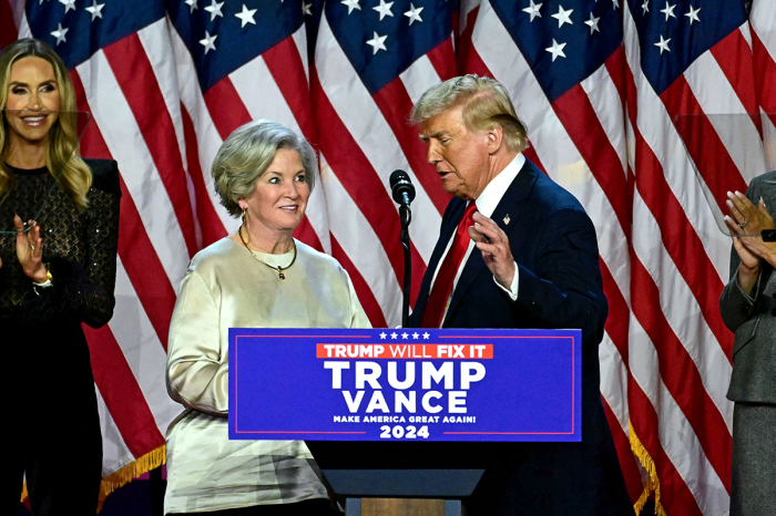 Former U.S. President and Republican presidential candidate Donald Trump greets his campaign manager Susie Wiles (L) during an election night event at the West Palm Beach Convention Center in West Palm Beach, Florida, on Nov. 6, 2024. 