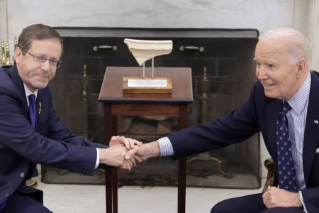 President Isaac Herzog (left) of Israel presents to U.S. President Joe Biden (right) an artifact from the foot of Temple Mount in Jerusalem during a meeting in the Oval Office of the White House on Nov. 12, 2024 in Washington, D.C. Biden met with Herzog to discuss the peace process in Gaza and Lebanon. 