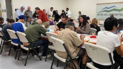 Participants take part in About My Father's Business sixth-annual Thanksgiving event on Nov. 21, 2024, at the field office Los Angeles City Councilmember Bob Blumenfield. 