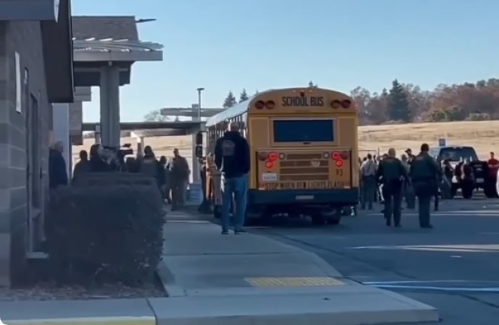 Students walk outside of Feather River School of Seventh-Day Adventists in Palermo, California, on Dec. 4, 2024, following a shooting that resulted in two children being wounded and the suspected shooter dying of a self-inflicted gunshot wound. 