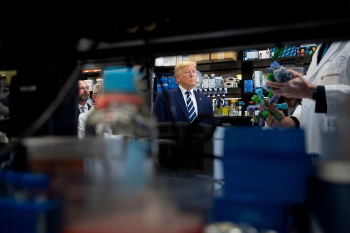 President Donald Trump looks on during a tour of the National Institutes of Health's Vaccine Research Center March 3, 2020, in Bethesda, Maryland.