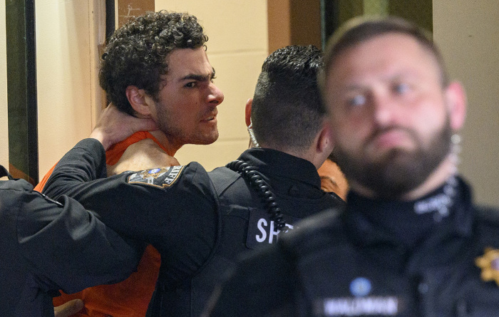 Suspected shooter Luigi Mangione is led into the Blair County Courthouse for an extradition hearing Dec. 10, 2024, in Hollidaysburg, Pennsylvania.