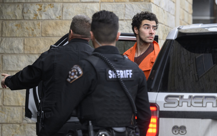 Suspected shooter Luigi Mangione is led into the Blair County Courthouse for an extradition hearing Dec. 10, 2024, in Hollidaysburg, Pennsylvania. Mangione has been arraigned on weapons and false identification charges related to the fatal shooting of United Healthcare CEO Brian Thompson in New York City. Mangione is incarcerated in the State Correctional Institution in Huntingdon, Pennsylvania awaiting extradition to New York.