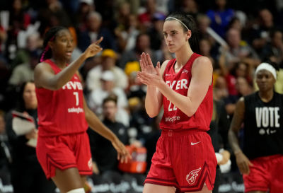 Aliyah Boston #7 and Caitlin Clark #22 of the Indiana Fever reacts as they play the Connecticut Sun during the fourth quarter of Game Two of the 2024 WNBA Playoffs first round at Mohegan Sun Arena on September 25, 2024 in Uncasville, Connecticut. 