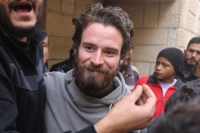 United States citizen Travis Timmerman, who had entered Syria from Lebanon on a Christian pilgrimage and had been detained for several months, speaks with reporters in a house in Damascus on December 12, 2024, after he was found in the village of Thihabiyeh east of the capital, after rebels toppled longtime president Bashar al-Assad. 