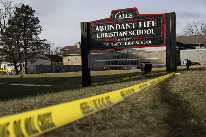 Crime scene tape continues to be stretched around Abundant Life Christian School as police continue to investigate yesterday's shooting on Dec. 17, 2024, in Madison, Wisconsin. Multiple people were shot and at least three have died after a teenage girl, who was a student at the school, opened fire inside the school.