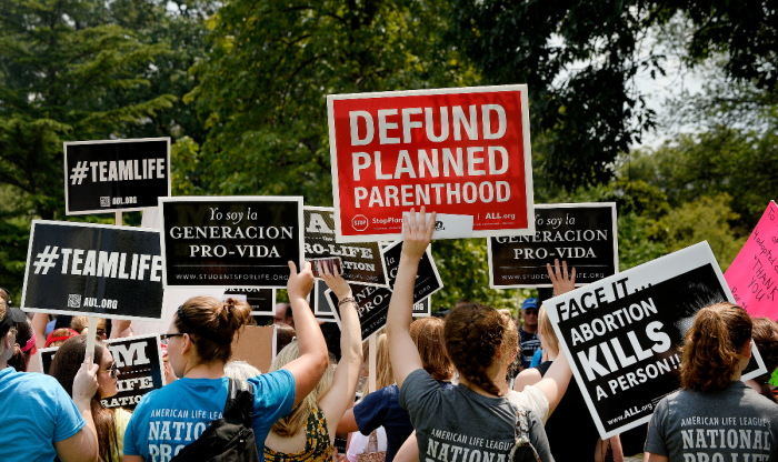 Activists hold a rally opposing federal funding for Planned Parenthood in front of the U.S. Capitol on July 28, 2015 in Washington, D.C. Sen. 