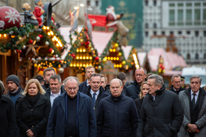 German Chancellor Olaf Scholz walks through the Christmas Market accompanied by Interior Minister Nancy Faeser and Saxony-Anhalt Premier Reiner Haseloff look as they visited the shuttered Christmas market the day after a terror attack that has left five people dead, including a small child, and 200 injured on Dec. 21, 2024, in Magdeburg, Germany. Police arrested a man after he drove a black BMW past security obstacles and into the busy Christmas market in the early evening yesterday. The attacker is reportedly a Saudi national who has been living in Germany since 2006 and worked as a psychotherapist. 