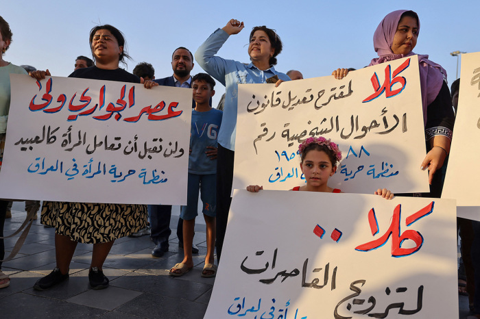 Activists demonstrate against female child marriages in Tahrir Square in central Baghdad on July 28, 2024, amid parliamentary discussion over a proposed amendment to the Iraqi Personal Status Law. Rights advocates are alarmed by a bill introduced to Iraq's parliament that, they fear, would roll back women's rights and increase underage marriage in the deeply patriarchal society