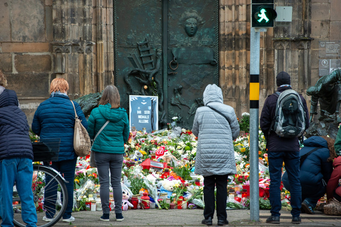 The sign at the Johanniskirche near the now closed Christmas market reads You are never alone on Dec. 23, 2024, in Magdeburg, Germany. The terror attack at the busy Magdeburg Christmas market has left five people dead, including a 9-year-old boy, and over 200 injured. The attacker, identified as Taleb al-Abdulmohsen, is a Saudi national who has been living in Germany since 2006 and worked as a psychotherapist. 