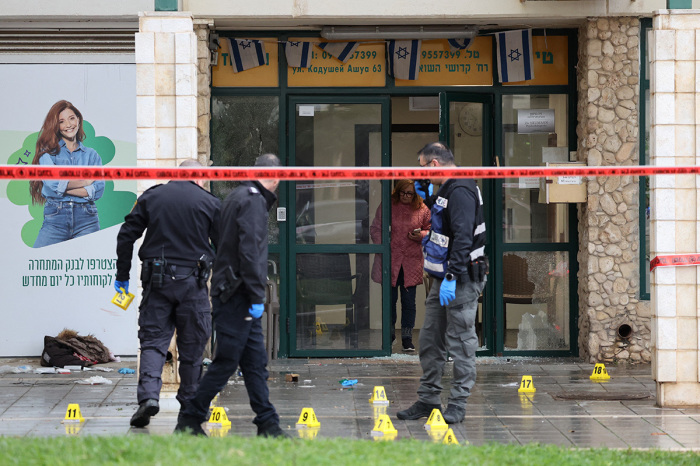 Israeli police check the scene of a stabbing attack in Herzliya, north of Tel Aviv, on Dec. 27, 2024. An Israeli hospital reported that a woman in her 80s was killed after being stabbed in the coastal city of Herzliya. Police say the suspected attacker has been arrested. 