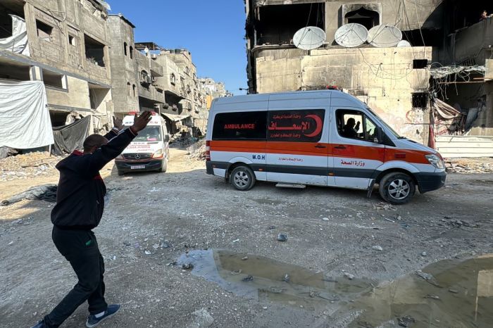 A Palestinian man gestures toward ambulances transporting those wounded by an Israeli bombing to the Kamal Adwan Hospital in Beit Lahia in the northern Gaza Strip, on November 23, 2024, amid the ongoing war between Israel and Hamas militants. 