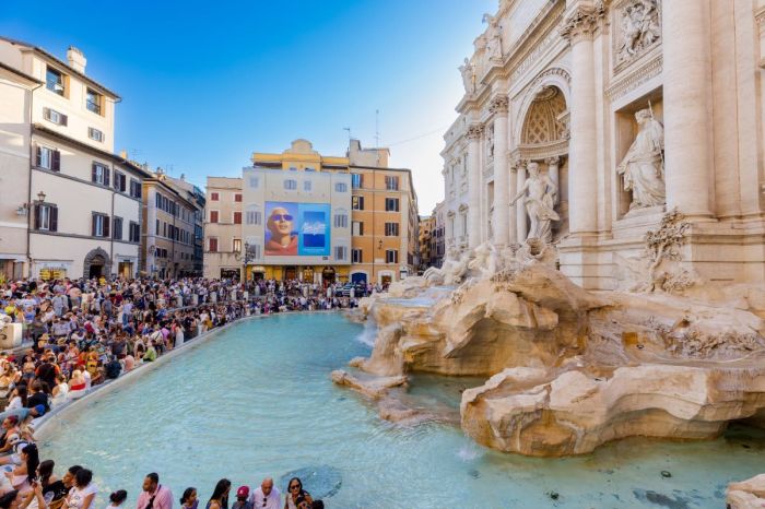 People gather at the Trevi Fountain in Rome, Italy. 