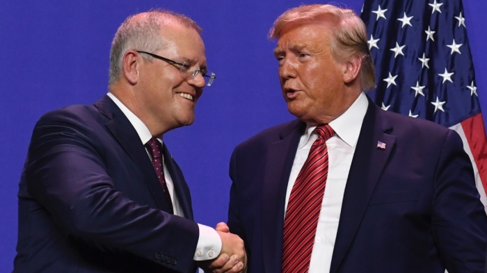 President Donald Trump and Australian Prime Minister Scott Morrison shake hands during a visit to Pratt Industries plant opening in Wapakoneta, Ohio, on Sept. 22, 2019.