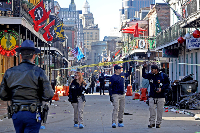 Law enforcement officers from multiple agencies work the scene on Bourbon Street after at least 15 people were killed when a person drove into the crowd in the early morning hours of New Year's Day on Jan. 1, 2025, in New Orleans, Louisiana. Dozens more were injured after a suspect in a rented pickup truck drove around barricades and through a crowd of New Year's revelers on Bourbon Street. The suspect then got out of the truck, opened fire on police officers, and was subsequently killed by law enforcement. 