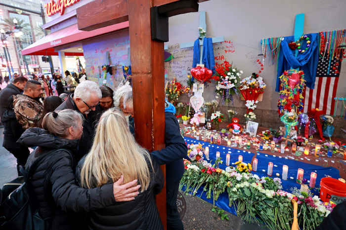 Bourbon Street terror attack victim Matthew Tenedorio's family and friends pray in front of a memorial on Bourbon Street at Canal Street on Jan. 4, 2025, in New Orleans, Louisiana. Fourteen people were killed and over 30 were injured when a driver intentionally drove into a crowd on Bourbon Street in the early morning hours of New Year's Day in what police are calling a terrorist attack. 