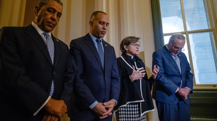 Rep. Adriano Espaillat, D-N.Y., House Minority Leader Hakeem Jeffries, D-N.Y., House Chaplain Margaret Grun Kibben, and Senate Minority Leader Chuck Schumer, D-N.Y., pray at the start of a January 6 commemoration press conference at the U.S. Capitol on Jan. 6, 2025, in Washington, D.C.