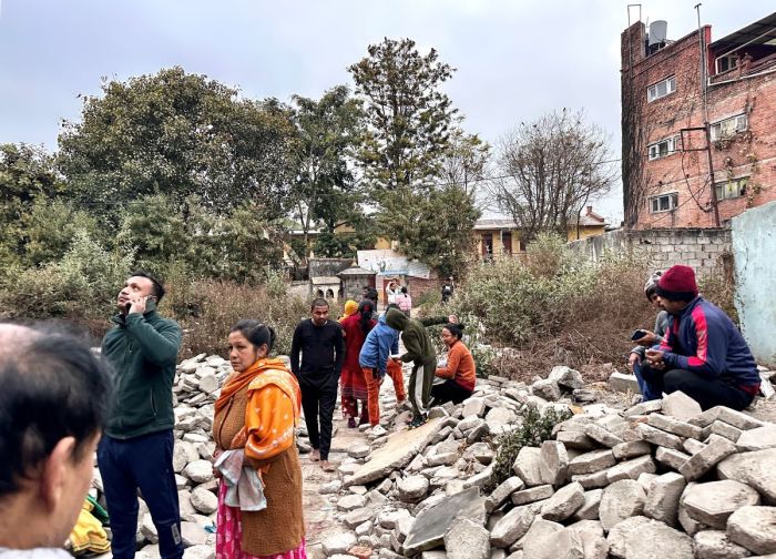 People gather in an open area following earthquake tremors in Kathmandu, in the early hours on January 7, 2025. A powerful earthquake in China's remote Tibet region killed at least 32 people and collapsed 'many buildings' on Jan. 7, 2024, Chinese media reported, with tremors also felt in neighbouring Nepal's capital Kathmandu and parts of India.