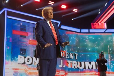 U.S. President-elect Donald Trump dances during Turning Point USA's AmericaFest at the Phoenix Convention Center on December 22, 2024 in Phoenix, Arizona. The annual four day conference geared toward energizing and connecting conservative youth hosts some of the country's leading conservative politicians and activists. 