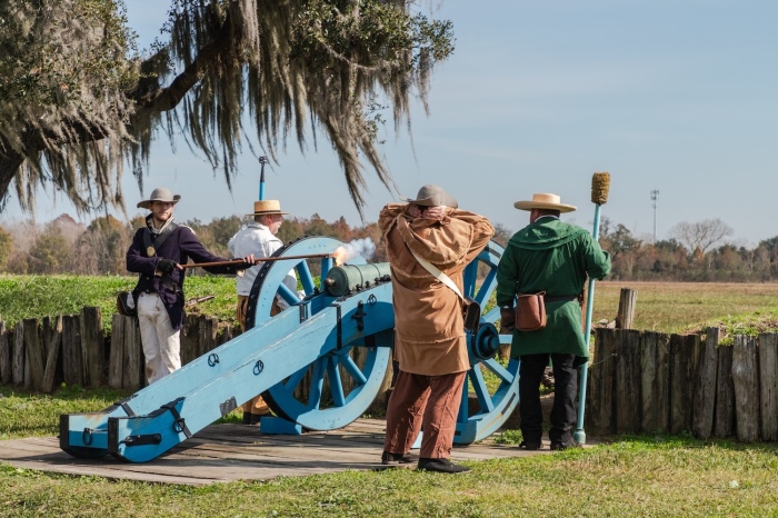 Reenactors fire a cannon over the battlefield after a ceremony marking the 210th anniversary of the 1815 Battle of New Orleans on Jan. 8, 2025. 