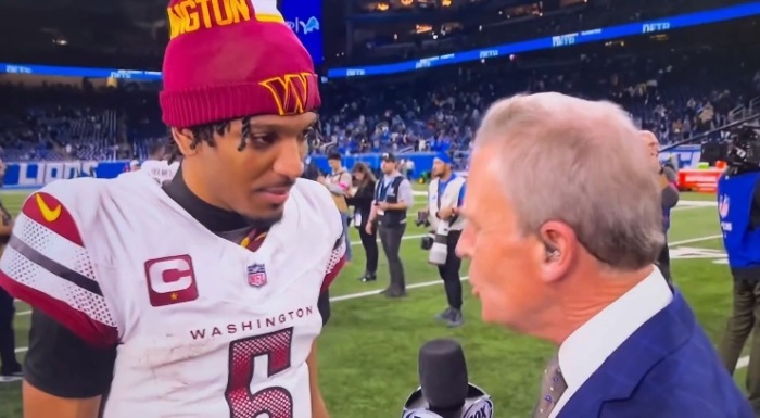 Washington Commanders quarterback Jayden Daniels speaks with Fox Sports after the team's victory against the Detroit Lions on Jan. 18, 2025, in Detroit, Michigan. 