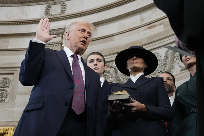 Donald Trump is sworn in as the 47th president of the United States by Chief Justice John Roberts as first lady Melania Trump holds the Bible in the US Capitol Rotunda in Washington, DC, on Jan. 20, 2025. Donald Trump takes office for his second term as the 47th president of the United States.